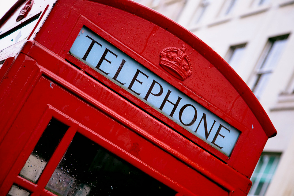 A close up of a red telephone box from London.